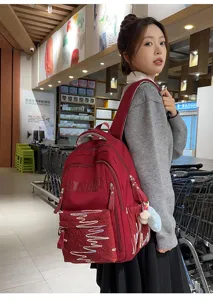 Stylish large capacity red school backpack for students, lightweight daily casual daypack bag.