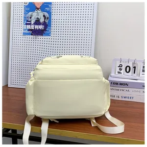 Minimalist casual backpack detail shot, light yellow daily school bag with multiple pockets.