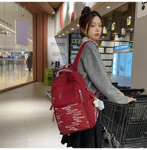 Red large capacity casual school backpack for students, stylish lightweight daily book bag.