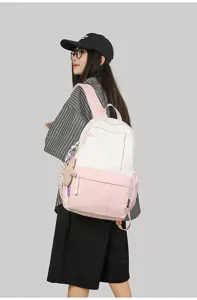 Casual canvas backpack for women, large capacity school bag with cute pendant and star design.