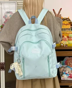 Cute light blue backpack with bow embroidery, large capacity daily casual school bag.