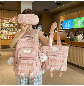 Pink quilted student backpack set detail view with cute bear pendant and large capacity.