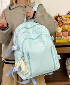 Cute bow embroidered canvas backpack, large capacity school bag for teen girls and students.