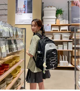 Large capacity color block school backpack for students, stylish design daily casual bag.