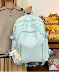 Cute mint green school backpack with bow embroidery, large capacity daily casual daypack for girls.