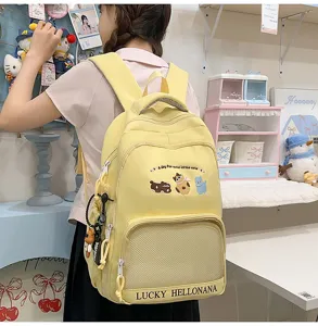 Cute yellow school backpack with cat embroidery and mesh pocket for teen girls and students.