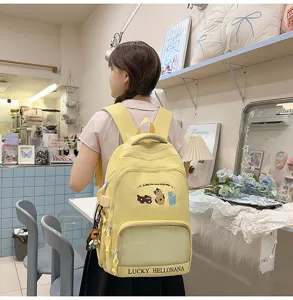 Cute yellow student backpack with cute animal embroidery, large capacity and convenient pockets.