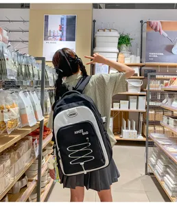 Detail view of the stylish Korean style colorblock backpack in a daily store scene display.