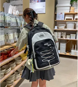 Detail shot of a trendy color-block backpack with spacious compartments and stylish drawstring.