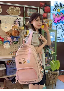 Cute pink school backpack for teen girls, large capacity casual travel daypack with cat embroidery.