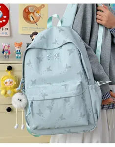 Cute butterfly print casual backpack, light blue canvas school bag with fluffy pendant.