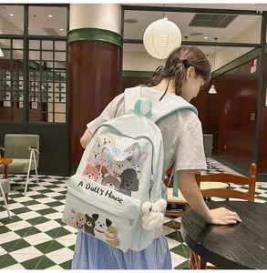 Detailed view of the cute mint green canvas backpack with adorable animal prints for daily use.