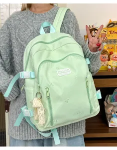 Cute aesthetic backpack for women, lightweight large capacity school bag with bow embroidery.