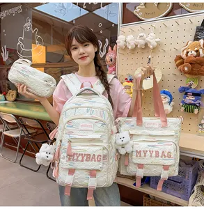 Student school backpack three-piece set with tote bag and pouch in stylish white quilted design.