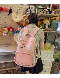 Pink student backpack detail view, featuring cute cat embroidery and large capacity design.