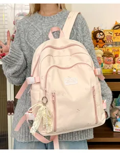 Cute bow embroidered pink backpack detail, large capacity canvas school bag for teen girls stylish.