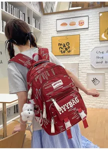 Large capacity red school backpack for teen girls students casual daypack with cute pendant.