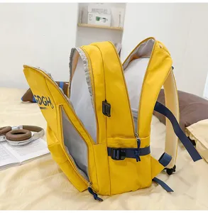 Detailed view of casual yellow canvas backpack with side zipper pockets and shoulder straps.