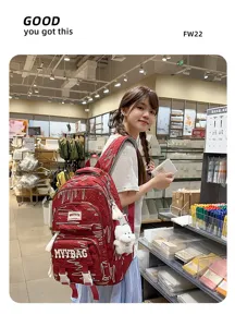 Large capacity student backpack in red with cute bear pendant and stylish patterns.