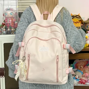 Cute pink bow embroidered backpack, large capacity sweet school bag for teen girls daily use.