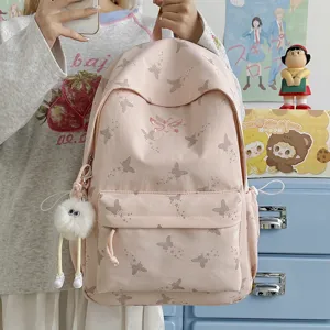 Pink butterfly print canvas backpack for women and students, large capacity casual daypack.