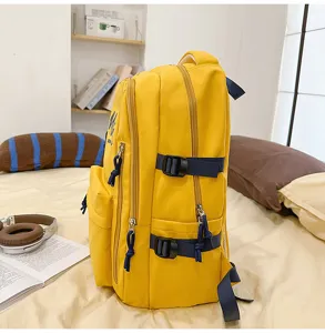 Yellow casual multi-pocket backpack side view detail showing straps and durable nylon fabric.