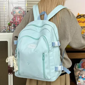 Cute bow embroidered backpack for women, casual large capacity school bag for teen girls.