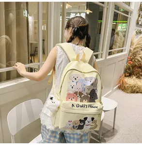 Cute yellow canvas backpack with cartoon animal prints and spacious capacity for daily school use.