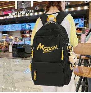 Casual minimalist black backpack with yellow straps, spacious and stylish for daily use.