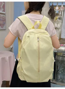 Cute embroidered bow backpack for school and travel, light yellow casual student bookbag.