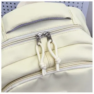 Close-up detail of casual canvas backpack zipper and handle, lightweight student school bag.