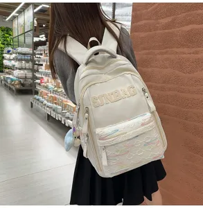 Korean style minimalist solid color large capacity school backpack with embroidery.