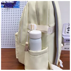 Light yellow backpack side detail view showcasing the side pocket and storage design features.