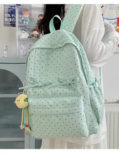 Mint green polka dot backpack with cute bows, ideal for cute school girls and daily lifestyle use.