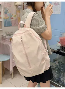 Pink canvas school backpack for women, cute bow embroidery, casual casual daypack travel bag.