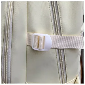 Backpack side detail featuring durable double zippers and adjustable white plastic buckle strap.