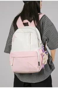 Casual pink white college backpack detail, cute star design and bear pendant for daily travel.