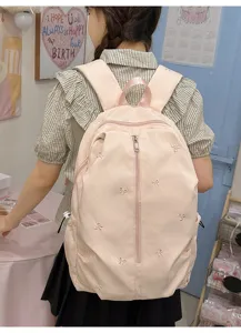 Cute pink canvas backpack with embroidered bows, perfect for students and casual daily travel.