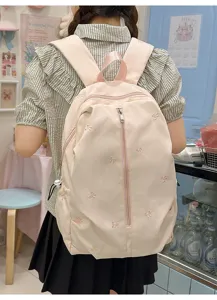 Pink cute bow embroidered canvas backpack detail, casual daily school bag for students and girls.