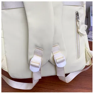 Close-up detail of the casual backpack showing adjustable straps and vertical zipper pocket.