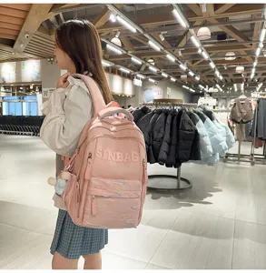 Detailed view of the solid pink large capacity school backpack, casual daily student book bag.