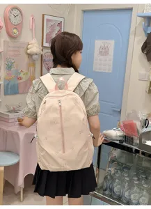 Cute pink bow embroidered canvas backpack for daily travel, school, and college use.