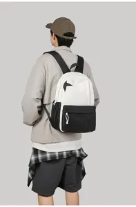 Casual black and white colorblock backpack featuring a stylish star design for daily use