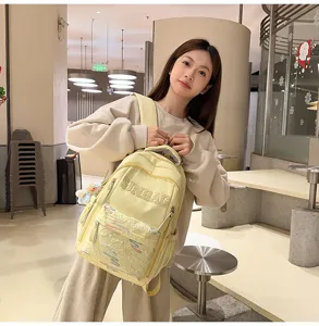Casual solid color large capacity backpack lightweight minimalist schoolbag for students.