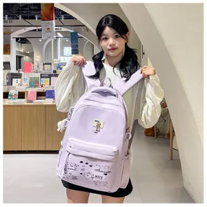 Close-up detail of the light purple casual school backpack showing cute prints in a library.