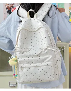 Japanese style cute polka dot backpack for women, casual school bookbag with bows.