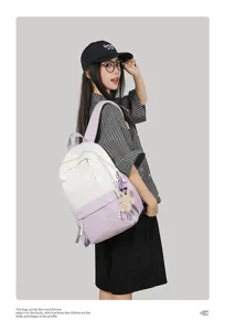 Detail view of the stylish color-block casual backpack in daily scene, showing great texture.