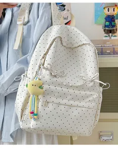 Japanese ins style white polka dot backpack with cute bow and plush pendant for daily use.