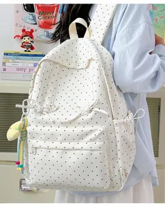 Japanese ins style cute polka dot backpack for women, casual canvas school bookbag with bow.