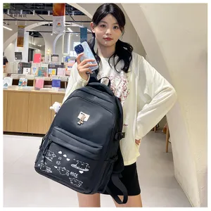 Detail view of stylish black casual backpack with cute doodles and front pocket for daily use.
